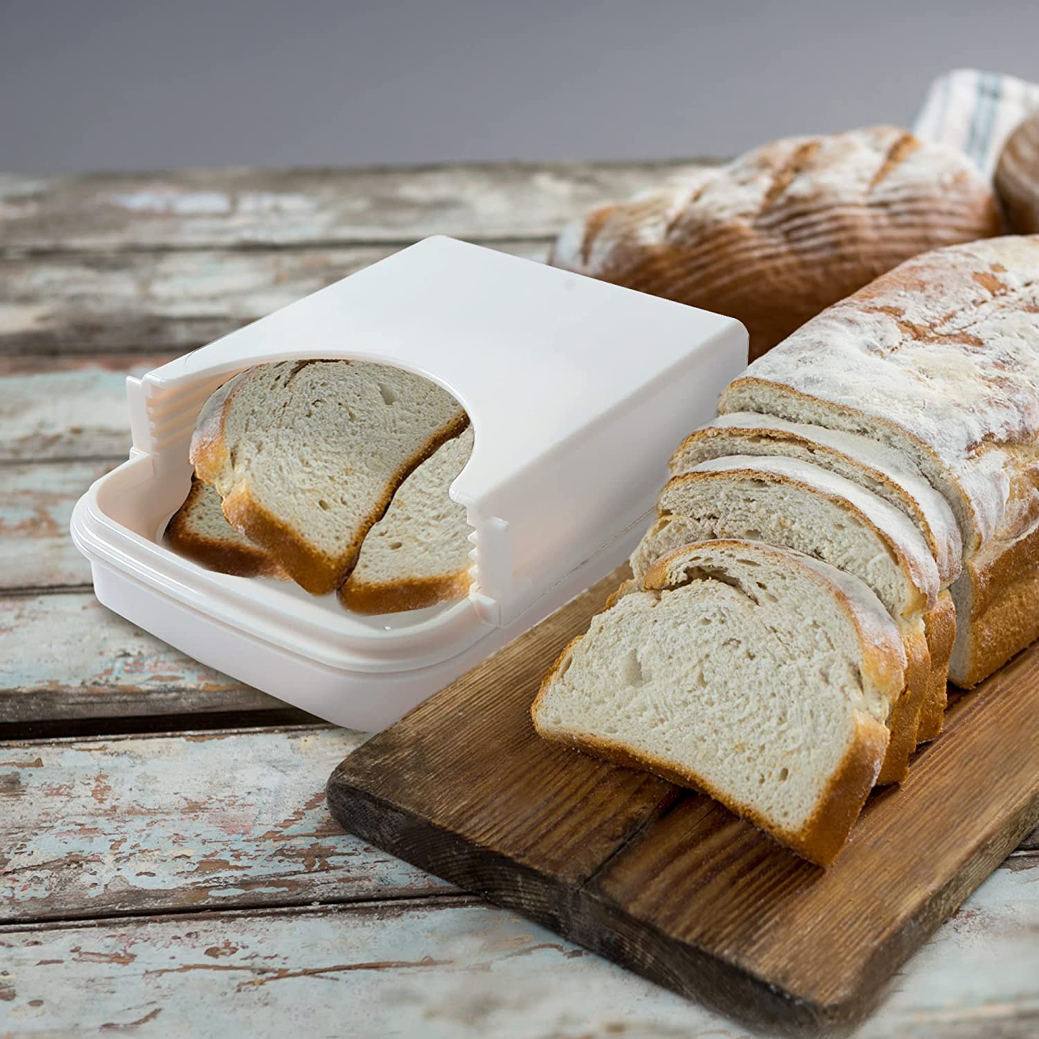 https://www.kitchenthinker.com/wp-content/uploads/2023/03/KitchenThinker-Bread-Slicer-for-Homemade-Bread-2.jpg